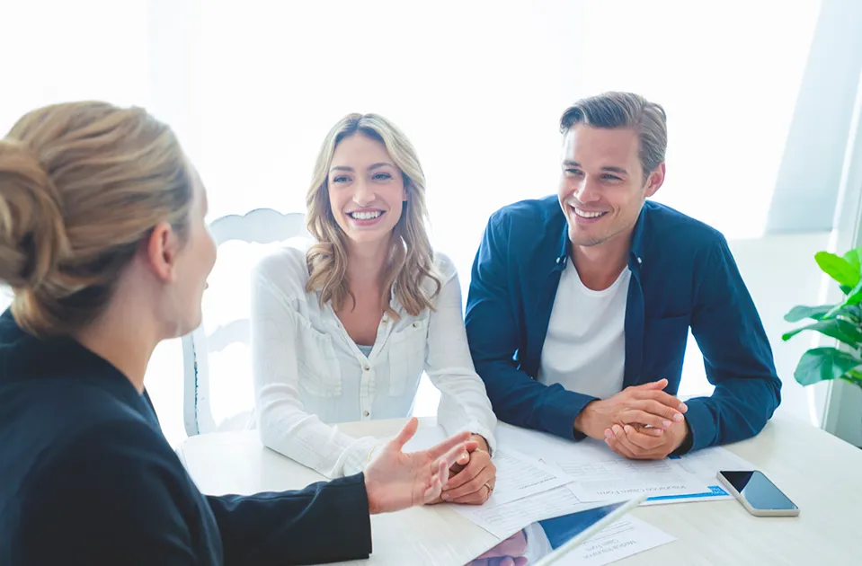 A couple discussing their home loan with an adviser