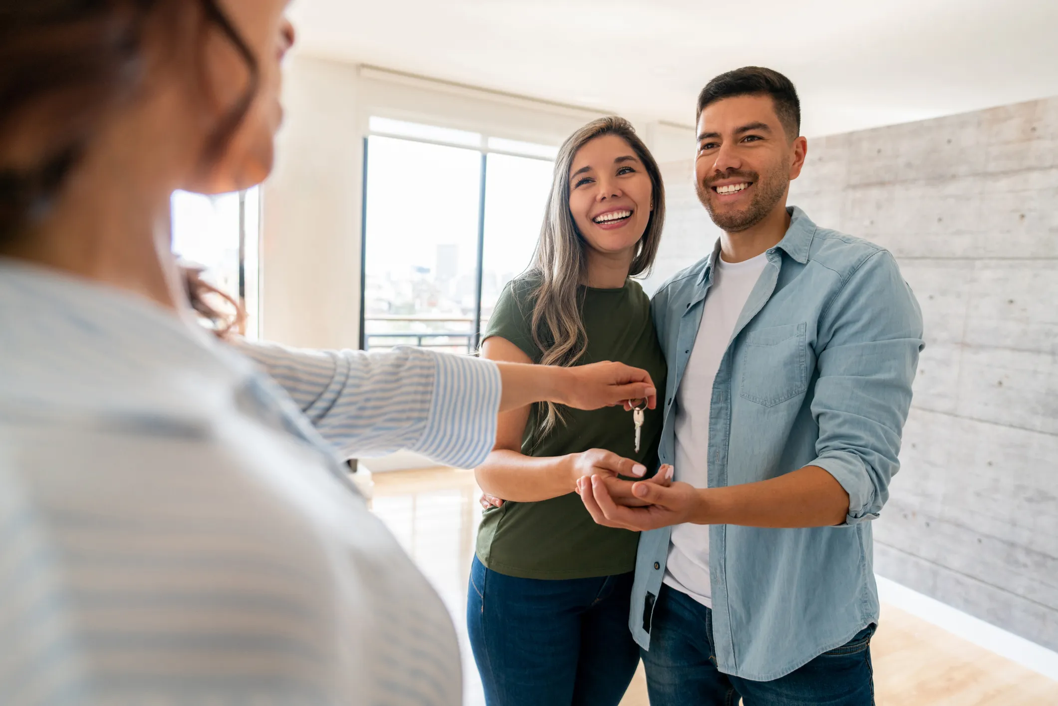 A couple receiving the keys to their new home