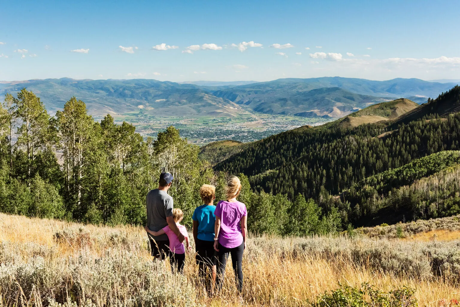 A family overlooking the mountain trails at Marcella
