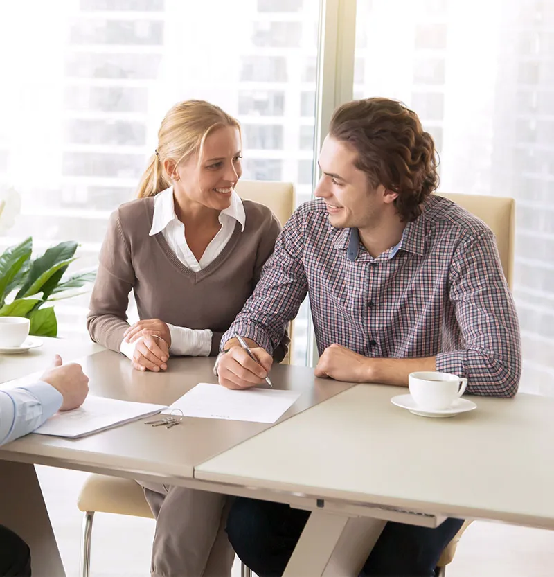 A couple discussing financing with an advisor