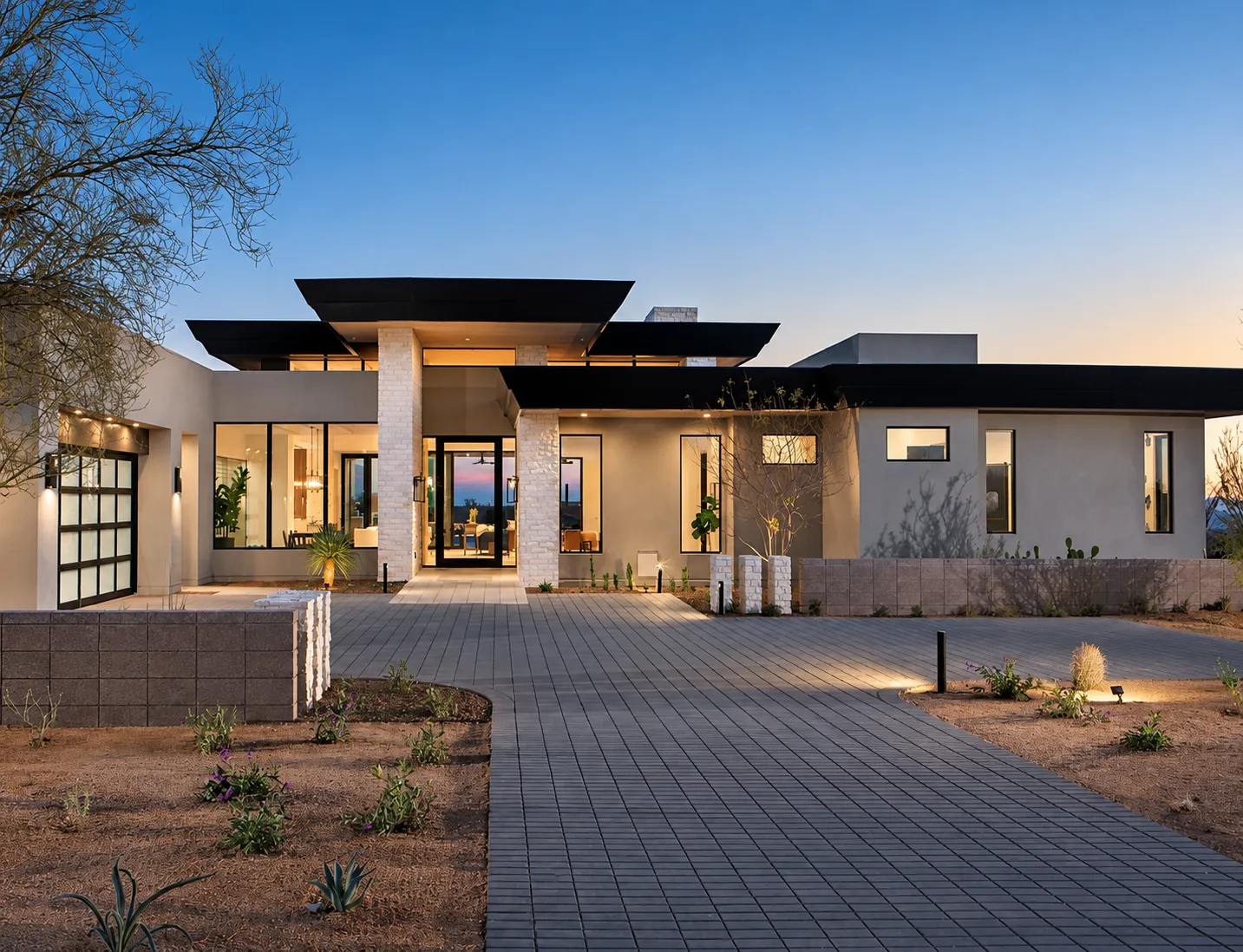 A warmly lit modern home at dusk